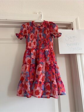 Ivy City Co Cordelia in Pink Floral Smocked Tiered Dress with Red & Blue Accents